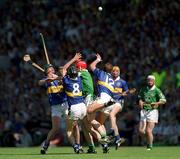 1 July 2001; David Kennedy, Thomas Dunne, 8, and Brian O'Meara, 12, of Tipperary contest a dropping ball with Ollie Moran of Limerick during the Guinness Munster Senior Hurling Final match between Tipperary and Limerick at Páirc Uí Chaoimh in Cork. Photo by Ray McManus/Sportsfile