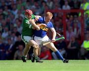 1 July 2001; Declan Ryan, Tipperary in action against TJ Ryan, Limerick. Tipperary v Limerick, Guinness Munster Senior Hurling Final, Pairc Ui Chaoimh, Co. Cork. Picture credit; Ray McManus / SPORTSFILE