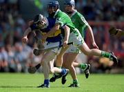 1 July 2001; Lar Corbett of Tipperary in action against Damien Reale of Limerick during the Guinness Munster Senior Hurling Final match between Tipperary and Limerick at Páirc Uí Chaoimh in Cork. Photo by Damien Eagers/Sportsfile
