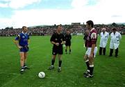 30 June 2001; Galway captain Kieran Comer and Wicklow captain Ronan Coffey pictured with referee Pat McEnaney during the Bank of Ireland All-Ireland Senior Football Championship Qualifier Round 2 match between Wicklow and Galway at Aughrim County Ground in Aughrim, Wicklow. Photo by Ray McManus/Sportsfile