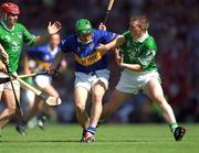 1 July 2001; Mark O'Leary of Tipperary in action against Mark Foley of Limerick during the Guinness Munster Senior Hurling Final match between Tipperary and Limerick at Páirc Uí Chaoimh in Cork. Photo by Ray McManus/Sportsfile