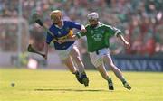 1 July 2001; Eamon Corcoran of Tipperary in action against Paul O'Grady of Limerick during the Guinness Munster Senior Hurling Final match between Tipperary and Limerick at Páirc Uí Chaoimh in Cork. Photo by Damien Eagers/Sportsfile