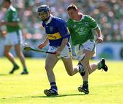 1 July 2001; Paul Kelly, Tipperary, in action against Ciaran Carey, Limerick. Tipperary v Limerick, Guinness Munster Hurling Final, Pairc Ui Chaoimh, Co Cork. Picture credit; Damien Eagers / SPORTSFILE