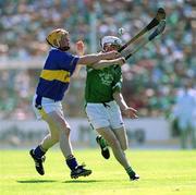 1 July 2001; Paul O'Grady of Limerick in action against Eamon Corcoran of Tipperary during the Guinness Munster Senior Hurling Final match between Tipperary and Limerick at Páirc Uí Chaoimh in Cork. Photo by Damien Eagers/Sportsfile
