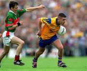 1 July 2001; Frankie Dolan of Roscommon in action against Ray Connelly of Mayo during the Bank of Ireland Connacht Senior Football Championship Final match between Roscommon and Mayo at Dr. Hyde Park in Roscommon. Photo by David Maher/Sportsfile