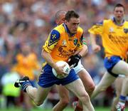 1 July 2001; Paul Noone of Roscommon in action against Trevor Mortimer of Mayo during the Bank of Ireland Connacht Senior Football Championship Final match between Roscommon and Mayo at Dr. Hyde Park in Roscommon. Photo by David Maher/Sportsfile