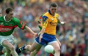1 July 2001; Seamus O'Neill of Roscommon in action against James Nallen of Mayo during the Bank of Ireland Connacht Senior Football Championship Final match between Roscommon and Mayo at Dr. Hyde Park in Roscommon. Photo by David Maher/Sportsfile