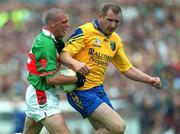 1 July 2001; Trevor Mortimer of Mayo in action against Fergal O'Donnell of Roscommon during the Bank of Ireland Connacht Senior Football Championship Final match between Roscommon and Mayo at Dr. Hyde Park in Roscommon. Photo by David Maher/Sportsfile