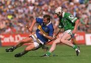1 July 2001; Brian O'Meara of Tipperary in action against Paul O'Grady of Limerick during the Guinness Munster Senior Hurling Final match between Tipperary and Limerick at Páirc Uí Chaoimh in Cork. Photo by Ray McManus/Sportsfile