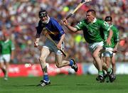 1 July 2001; Lar Corbett of Tipperary in action against Mark Foley of Limerick during the Guinness Munster Senior Hurling Final match between Tipperary and Limerick at Páirc Uí Chaoimh in Cork. Photo by Ray McManus/Sportsfile
