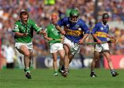 1 July 2001; Mark O'Leary of Tipperary in action against Mark Foley of Limerick during the Guinness Munster Senior Hurling Final match between Tipperary and Limerick at Páirc Uí Chaoimh in Cork. Photo by Ray McManus/Sportsfile
