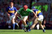 1 July 2001; TJ Ryan of Limerick in action against Eoin Kelly of Tipperary during the Guinness Munster Senior Hurling Final match between Tipperary and Limerick at Páirc Uí Chaoimh in Cork. Photo by Ray McManus/Sportsfile