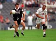 7 July 2001; Eamonn O'Hara, Sligo runs clear of Willie McCreery, Kildare, Kildare. Kildare v Sligo, All-Ireland Senior Football Championship Qualifier, Round 3, Croke Park, Dublin. Picture credit; Ray McManus / SPORTSFILE