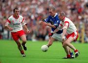 8 July 2001; Paul Galligan, Cavan is tackled by Chris Lawn, 17, Tyrone.  Tyrone v Cavan, Ulster Senior Football Championship Final, St. Tighearnach's Park Clones.  picture credit; David Maher / SPORTSFILE