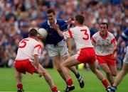 8 July 2001; Thomas Prior, Cavan is tackled by Ryan McMenamin, 5, and Colin Holmes, Tyrone.  Tyrone v Cavan, Ulster Senior Football Championship Final, St. Tighearnach's Park Clones.  Picture credit; Damien Eagers / SPORTSFILE