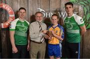 11 June 2016; 3rd place in the U14 Féile Peil na nÓg, Muireann Devaney from Glencar Manorhamilton GAA Club, Co. Leitrim, being presented with her winners trophy by Finbar O'Driscoll, Leinster President of Ladies GAA, and John West ambassadors, Philly McMahon, left, and Danny Sutcliffe, at the John West Féile National Skills Star Challenge 2016, in the National Games Development Centre, Abbotstown, Dublin. Photo by Sportsfile