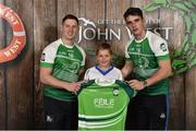 11 June 2016; U14 Féile Peil na nÓg participant Padraig Fitzgerald from Kilrossanty GAA Club, Co. Waterford, being presented with a commemorative jersey by John West ambassadors, Philly McMahon, left, and Danny Sutcliffe, at the John West Féile National Skills Star Challenge 2016, in the National Games Development Centre, Abbotstown, Dublin. Photo by Sportsfile