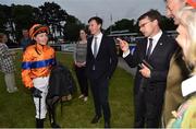 9 June 2016; Jockey Ana O'Brien, left, in conversation with her father Aidan O'Brien and brother/trainer Joseph O'Brien, centre, after winning the Copper Face Jacks Handicap on No Biggie during the Bulmer's Evening Meeting in Leopardstown, Co. Dublin. Photo by Cody Glenn/Sportsfile