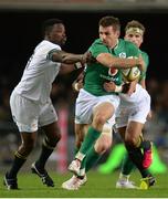 11 June 2016; Jared Payne of Ireland offloads a pass while being tackled by Lwazi Mvovo, left, and Rudy Paige of South Africa during the 1st test of the Castle Lager Incoming series between South Africa and Ireland at the DHL Newlands Stadium in Cape Town, South Africa. Photo by Brendan Moran/Sportsfile