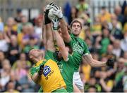 12 June 2016; Sean Quigley and Eoin Donnelly of Fermanagh in action against Neil McGee and Hugh McFadden of Donegal during the Ulster GAA Football Senior Championship Quarter-Final match between Fermanagh and Donegal at MacCumhaill Park in Ballybofey, Co. Donegal. Photo by Oliver McVeigh/Sportsfile