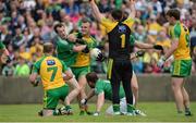 12 June 2016; Neil McGee of Donegal strikes out at Ruairi Corrigan of Fermanagh, McGee was subsequently shown a red card and a penalty was awarded, during their Ulster GAA Football Senior Championship Quarter-Final match between Fermanagh and Donegal at MacCumhaill Park in Ballybofey, Co. Donegal. Photo by Oliver McVeigh/Sportsfile