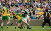 12 June 2016; Sean Quigley and Eoin Donnelly of Fermanagh in action against Neil McGee and Hugh McFadden of Donegal during their Ulster GAA Football Senior Championship Quarter-Final match between Fermanagh and Donegal at MacCumhaill Park in Ballybofey, Co. Donegal. Photo by Oliver McVeigh/Sportsfile