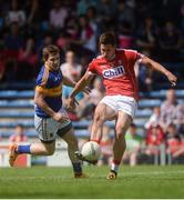 12 June 2016; Conor Dorman of Cork scores a point under pressure from Robbie Kiely of Tipperary during the Munster GAA Football Senior Championship Semi-Final match between Tipperary and Cork at Semple Stadium in Thurles, Co. Tipperary. Photo by Piaras Ó Mídheach/Sportsfile