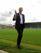 11 July 2010; Broadcaster Mícheál Ó Muircheartaigh walks the pitch ahead of the game. Munster GAA Hurling Senior Championship Final, Cork v Waterford, Semple Stadium, Thurles, Co. Tipperary. Picture credit: Stephen McCarthy / SPORTSFILE
