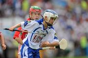 11 July 2010; Gavin Ryan, Ballymacarbry NS, Waterford, in action against Aaron Myers, Riverstown NS, Cork during the Half-time Go Games during the Munster GAA Hurling Championship Finals, Semple Stadium, Thurles, Co. Tipperary. Picture credit: Barry Cregg / SPORTSFILE