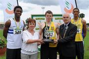 11 July 2010; Paula O'Doherty, daughter of Paddy Larkin, and Liam Hennessy, President, Athletics Ireland, present Jonathan Holmes, Kilkenny City Harriers AC, with the Paddy Larkin Memorial Trophy for winning the Men's 100m, from bronze medallist Seye Ogunlewe, left, Celbridge AC, and silver medallist Steven Colvert, right, Crusaders AC, during during the Woodie's DIY AAI Senior Track & Field Championships. Morton Stadium, Santry, Dublin. Picture credit: Brendan Moran / SPORTSFILE