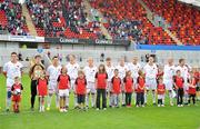 13 July 2010; Munster XI players stand with their mascots before the game. Friendly in Aid of Shane Geoghegan Trust, Munster XI v Sunderland AFC, Thomond Park, Limerick. Picture credit: Diarmuid Greene / SPORTSFILE