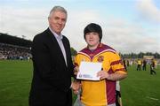 14 July 2010; James Ryan, Craobh Chiarain, Dublin, is presented with his prize by Ger Cunningham, Sports Sponsorship manager Bord Gáis Energy, following his victory in the Bord Gáis Energy Crossbar Challenge at half-time in the Bord Gáis Energy GAA Hurling Under 21 Leinster Final between Dublin and Wexford. Parnell Park, Dublin. Picture credit: Stephen McCarthy / SPORTSFILE