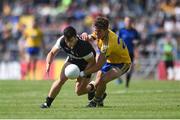 12 June 2016; Pat Hughes of Sligo is tackled by Sean Mullooly of Roscommon in their Connacht GAA Football Senior Championship Semi-Final match between Roscommon and Sligo at Dr. Hyde Park in Roscommon. Photo by Ramsey Cardy/Sportsfile