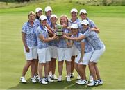 12 June 2016; The GB&I team, from left, team manager Helen Hewlett, Olivia Mehaffey, Leona Maguire, Meghan MacLaren, Charlotte Thomas, team captain Elaine Farquharson-Black, Bronte Law, Alice Hewson, Maria Dunne and Rochelle Morris celebrate with the Curtis Cup after GB&I beat the USA to win the Curtis Cup during day three of the Curtis Cup Matches at Dun Laoghaire Golf Club in Enniskerry, Co. Wicklow. Photo by Matt Browne/Sportsfile