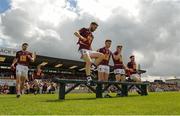 12 June 2016; Kevin Maguire of Westmeath jumps the bench before the team photo ahead of the Leinster GAA Football Senior Championship Quarter-Final match between Westmeath and Offaly at Cusack Park in Mullingar, Co. Westmeath. Photo by Seb Daly/Sportsfile