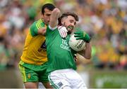 12 June 2016; James McMahon of Fermanagh in action against Frank McGlynn of Donegal during their Ulster GAA Football Senior Championship Quarter-Final match between Fermanagh and Donegal at MacCumhaill Park in Ballybofey, Co. Donegal. Photo by Oliver McVeigh/Sportsfile