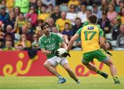 12 June 2016;  Marty O'Brien of Fermanagh in action against Eamonn McGee of Donegal during their Ulster GAA Football Senior Championship Quarter-Final match between Donegal and Fermanagh  at MacCumhaill Park in Ballybofey, Co. Donegal. Photo by Philip Fitzpatrick/Sportsfile