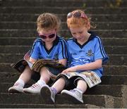 11 June 2016; Dublin supporters Aoife Masterson, five years, left, and her seven year old sister Aoife read their copy of the Cúl Magazine as they wait for the start of the Leinster GAA Hurling Senior Championship Semi-Final match between Dublin and Kilkenny at O'Moore Park in Portlaoise, Co. Laois. Photo by Ray McManus/Sportsfile