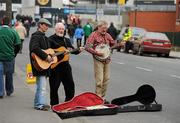 13 March 2010; Buskers play music for supporters as they walk up Jones's Road ahead of the game. RBS Six Nations Rugby Championship, Ireland v Wales, Croke Park, Dublin. Picture credit: Ray McManus / SPORTSFILE