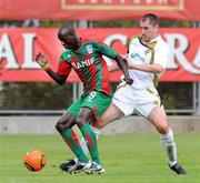 15 July 2010; Baba Diawara, CS Marítimo, in action against Colin Hawkins, Sporting Fingal. UEFA Europa League Second Qualifying Round - 1st Leg, CS Marítimo v Sporting Fingal, Estádio da Madeira, Funchal, Madeira, Portugal. Picture credit: Helder Santos / SPORTSFILE