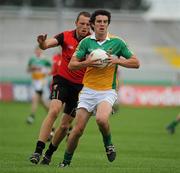 17 July 2010; Richie Dalton, Offaly, in action against Ambrose Rogers, Down. GAA Football All-Ireland Senior Championship Qualifier Round 3, Down v Offaly, O'Connor Park, Tullamore, Co. Offaly. Picture credit: Barry Cregg / SPORTSFILE
