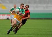 17 July 2010; Anton Sullivan, Offaly, in action against Darren O' Hagan, Down. GAA Football All-Ireland Senior Championship Qualifier Round 3, Down v Offaly, O'Connor Park, Tullamore, Co. Offaly. Picture credit: Barry Cregg / SPORTSFILE