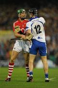 17 July 2010; Eoin Cadogan, Cork, and Eoin Kelly, Waterford, jostle before the referee issued a yellow card to Kelly. Munster GAA Hurling Senior Championship Final Replay, Cork v Waterford, Semple Stadium, Thurles, Co. Tipperary. Picture credit: Ray McManus / SPORTSFILE