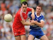 18 July 2010; Cathal McCarron, Tyrone, in action against Tomas Freeman, Monaghan. Ulster GAA Football Senior Championship Final, Monaghan v Tyrone, St Tighearnach's Park, Clones, Co. Monaghan. Picture credit: Brendan Moran / SPORTSFILE