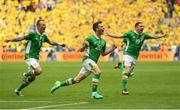 13 June 2016; Wes Hoolahan, centre, of Republic of Ireland celebrates after he scored his side's first goal during the UEFA Euro 2016 Group E match between Republic of Ireland and Sweden at Stade de France in Saint Denis, Paris, France. Photo by Stephen McCarthy/Sportsfile