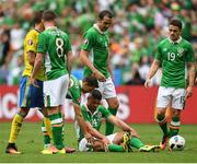 13 June 2016; Jon Walters, centre, of Republic of Ireland reacts after a tackle while team-mates, from left, James McCarthy, Wes Hoolahan, John O'Shea and Robbie Brady watch on during the UEFA Euro 2016 Group E match between Republic of Ireland and Sweden at Stade de France in Saint Denis, Paris, France. Photo by Stephen McCarthy/Sportsfile