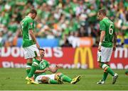 13 June 2016; Jon Walters, centre, of Republic of Ireland reacts after a tackle while team-mates James McCarthy, left, and Glen Whelan watch on during the UEFA Euro 2016 Group E match between Republic of Ireland and Sweden at Stade de France in Saint Denis, Paris, France. Photo by Stephen McCarthy/Sportsfile