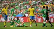 13 June 2016; Jon Walters, centre left, of Republic of Ireland reacts after a tackle while team-mate Shane Long, right, speaks with referee Milorad Mazic during the UEFA Euro 2016 Group E match between Republic of Ireland and Sweden at Stade de France in Saint Denis, Paris, France. Photo by Stephen McCarthy/Sportsfile