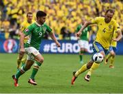 13 June 2016; Shane Long of Republic of Ireland in action against Andreas Granqvist of Sweden  in the UEFA Euro 2016 Group E match between Republic of Ireland and Sweden at Stade de France in Saint Denis, Paris, France. Photo by David Maher/Sportsfile