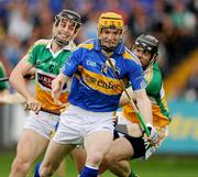 18 July 2010; Lar Corbett, Tipperary, in action against Rory Hanniffy and Paul Cleary, Offaly. GAA Hurling All-Ireland Senior Championship Phase 3, Tipperary v Offaly, O'Moore Park, Portlaoise, Co. Laois. Picture credit: Ray McManus / SPORTSFILE